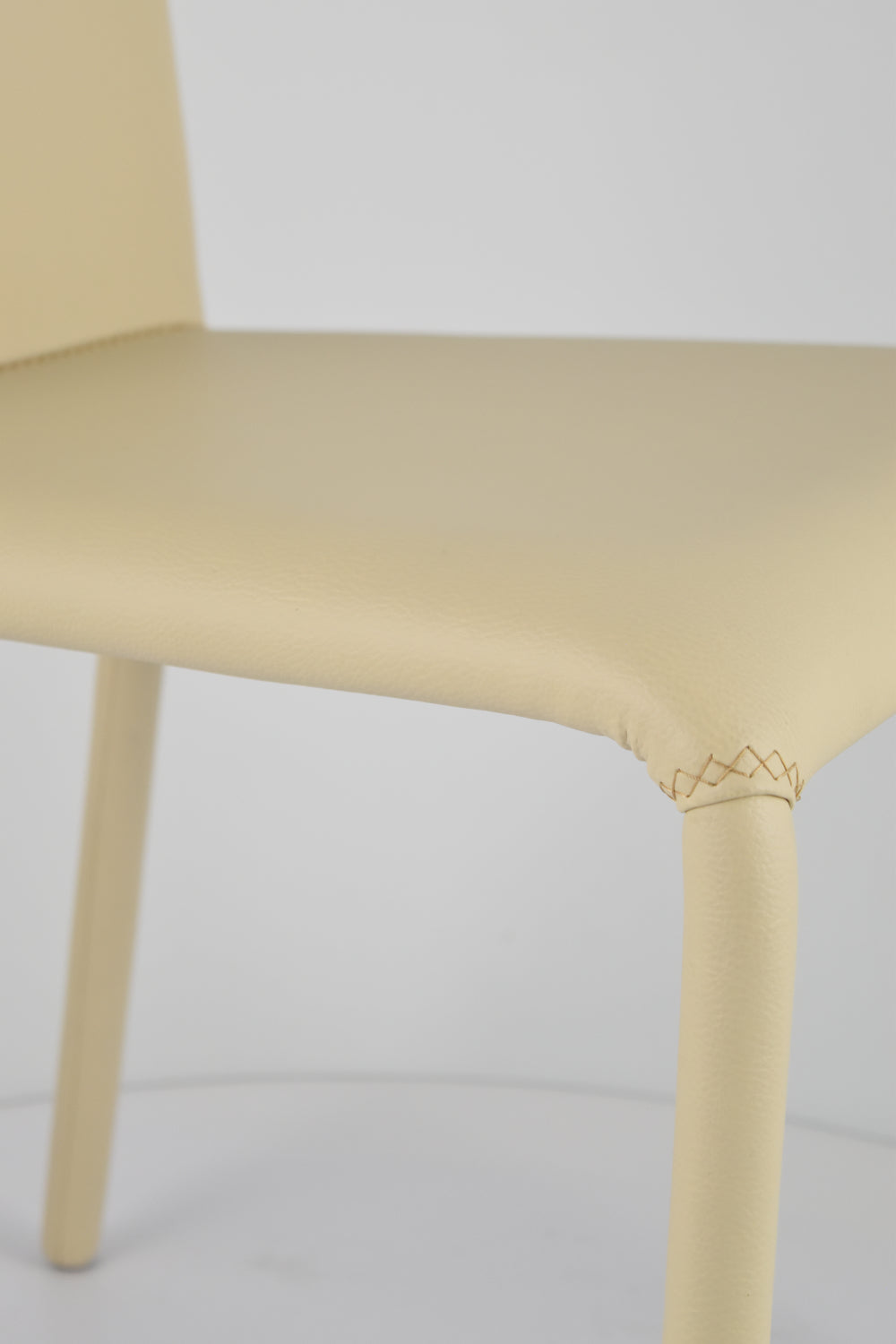 Stock second choice chair model MGR174 upholstered in sand artificial leather