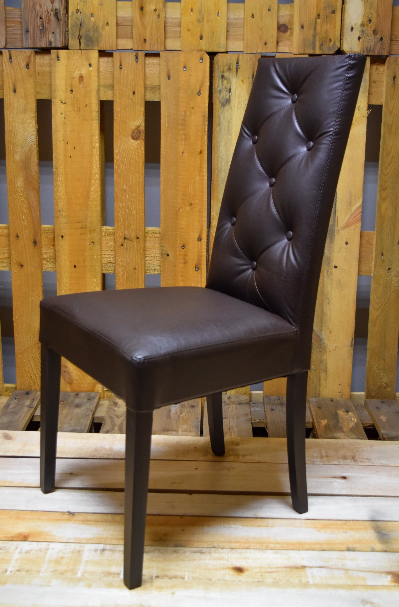 Stock chairs model 35 upholstered in brown imitation leather