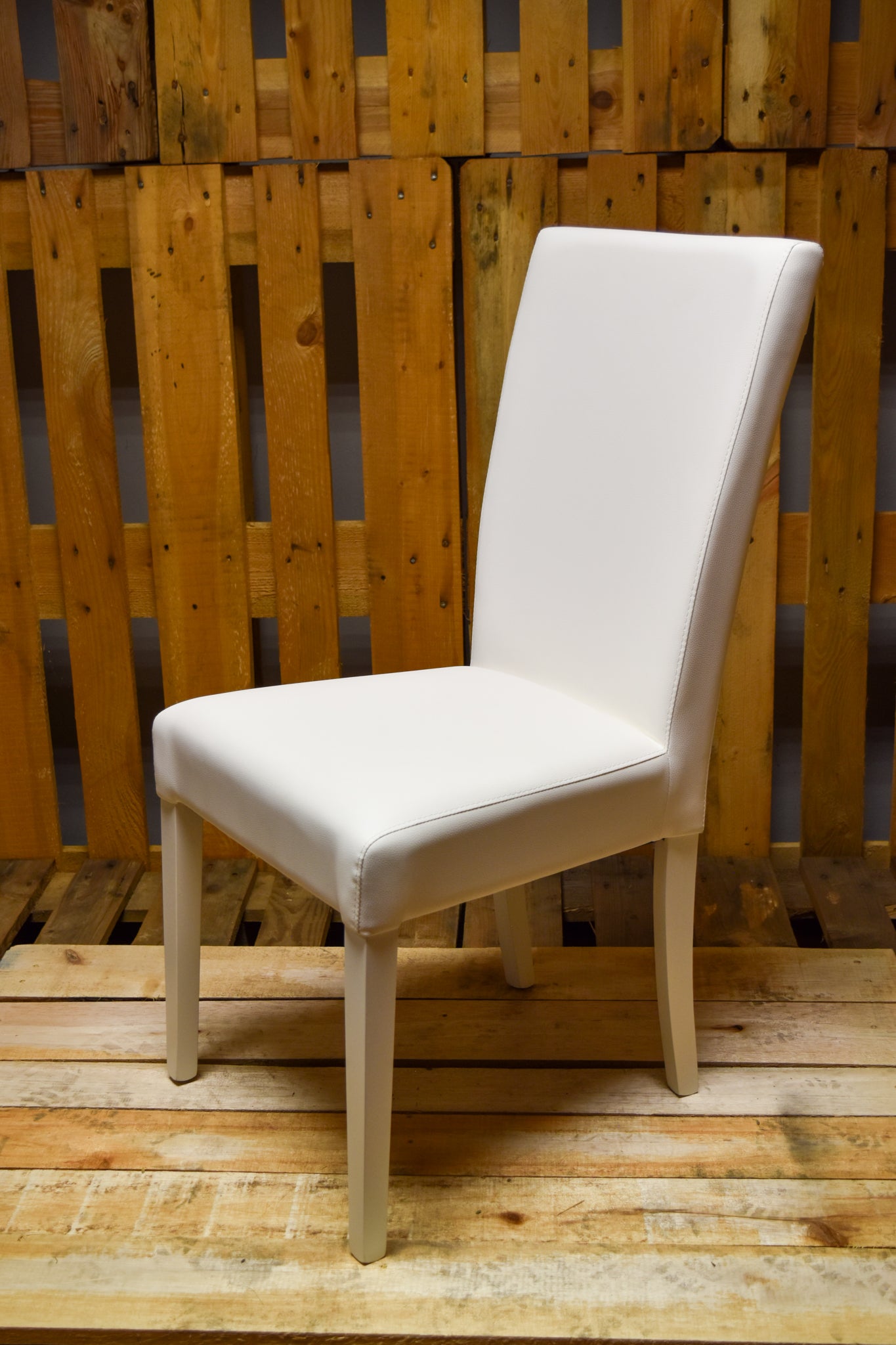 Stock model 46 white padded chairs