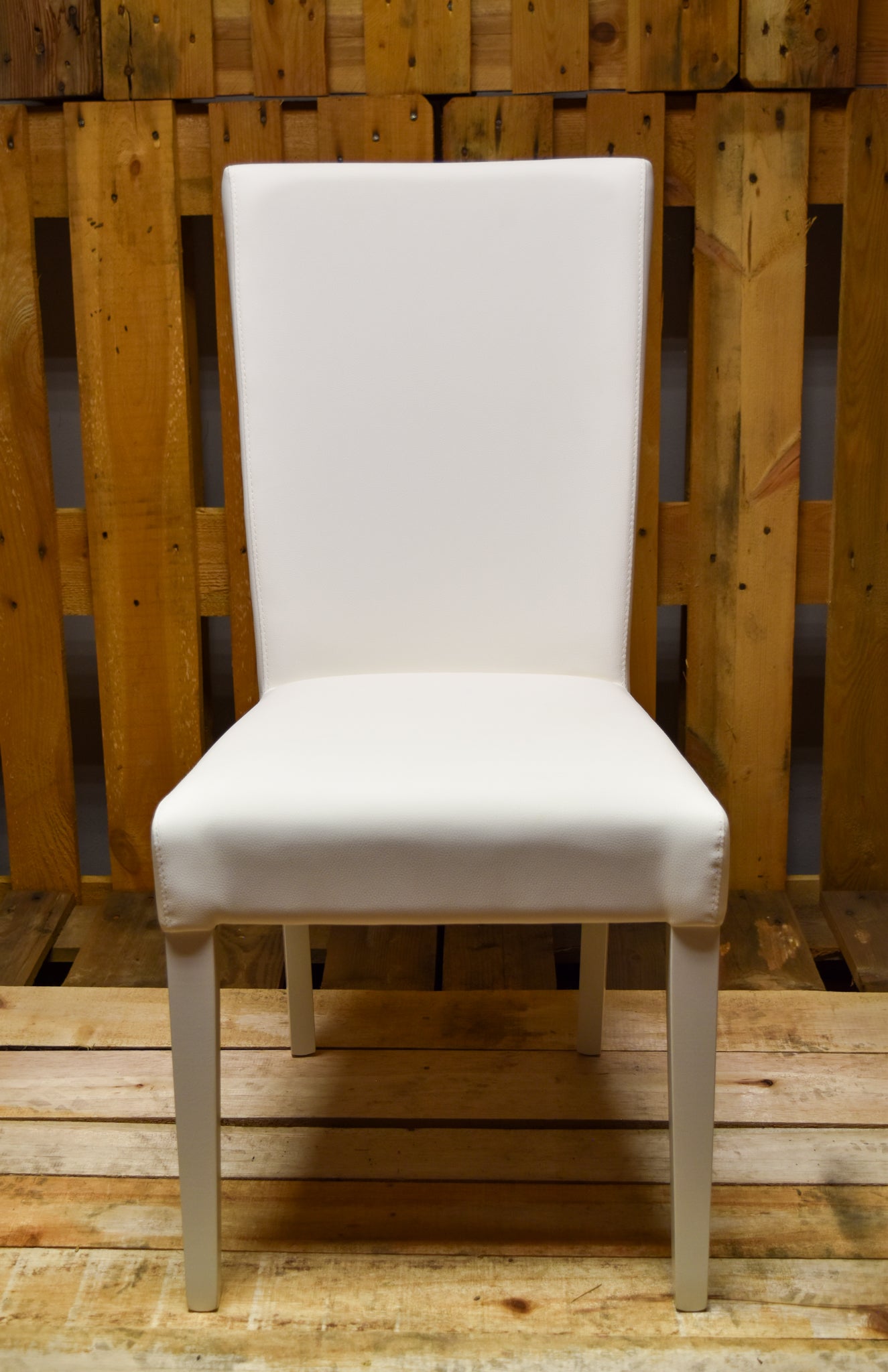 Stock model 46 white padded chairs